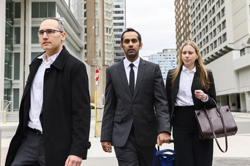 <p>Umar Zameer and his lawyers walk away from the courthouse following his not guilty verdict, in Toronto, Sunday, April 21, 2024. The office of Canada's justice minister says the public should expect politicians to support their right to bail and to be presumed innocent - warning that "immediate" and "uninformed reactions" only worsens matters. THE CANADIAN PRESS/Christopher Katsarov</p>