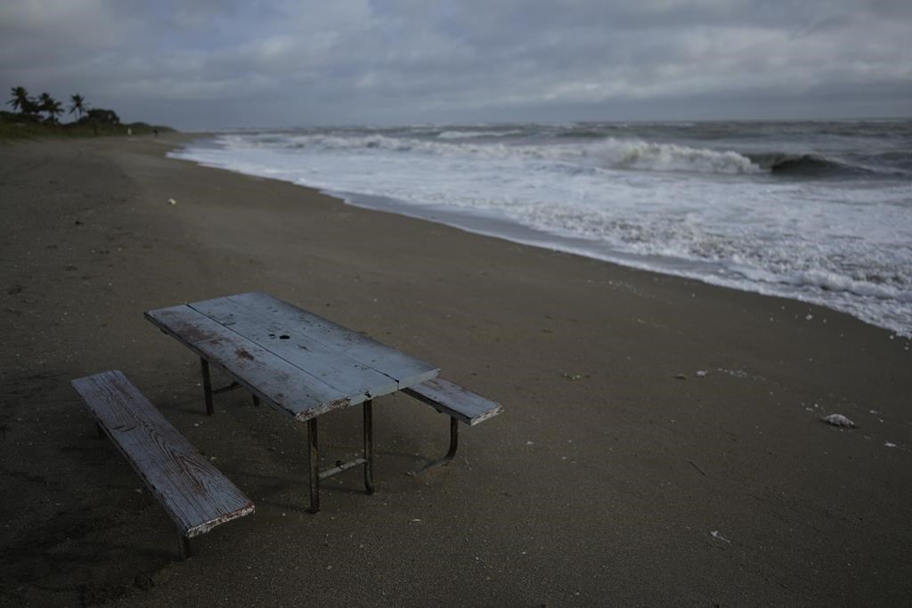 Waves crash high on the beach following the passage of hurricane Nicole, Thursday, Nov. 10, 2022, in Fort Pierce, Fla. The remnants of Nicole are expected to bring heavy rainfall in much of Atlantic Canada and southern Quebec. THE CANADIAN PRESS/AP-Rebecca Blackwell