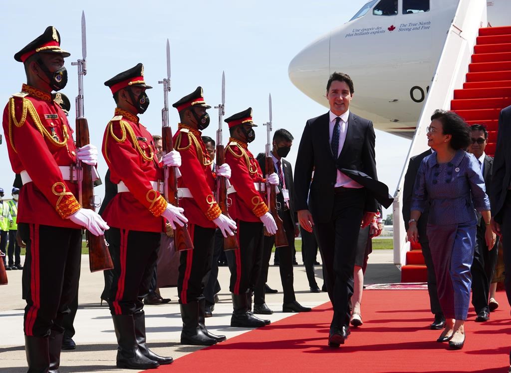 Prime Minister Justin Trudeau is greeted by Cambodia's Minister of Women's Affairs Ing Kantha Phavi as he arrives in Phnom Penh, Cambodia on Saturday, Nov. 12, 2022, to attend the ASEAN Summit. THE CANADIAN PRESS/Sean Kilpatrick