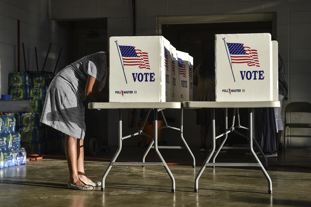 A voter casts their ballot in the 2022 midterm elections early Tuesday at Fire Station 26 in Jackson, Miss., Nov. 8, 2022. (Hannah Mattix/The Clarion-Ledger via AP)