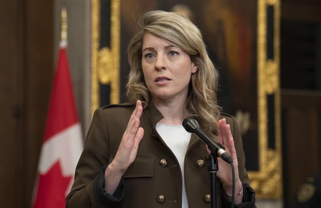 Foreign Affairs Minister Melanie Joly speaks with reporters in the Foyer of the House of Commons about the situation in Sudan, Thursday, April 27, 2023 in Ottawa. Joly is wrapping up a visit to Kenya where she heard from Canadians evacuated from Sudan and asked leaders from across East Africa how Canada can help bring about peace. THE CANADIAN PRESS/Adrian Wyld