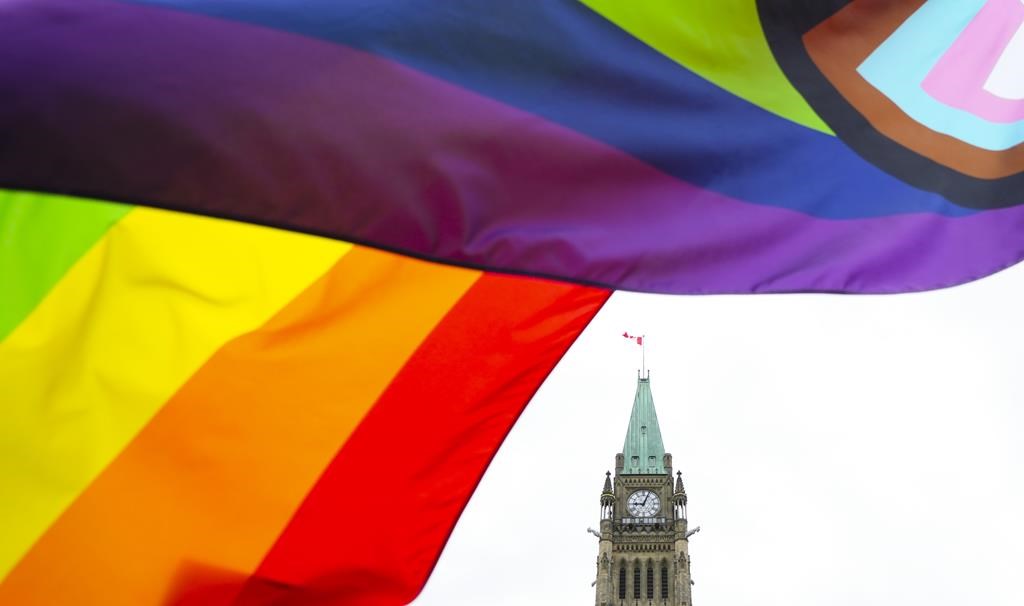 A Pride flag flies on Parliament Hill in Ottawa on Thursday, June 8, 2023, during a Pride event. Despite a federal ban on conversion therapy being in place for more than a year, advocates worry the broader ideologies underpinning the practice continue to have a strong foothold in Canada. THE CANADIAN PRESS/Sean Kilpatrick