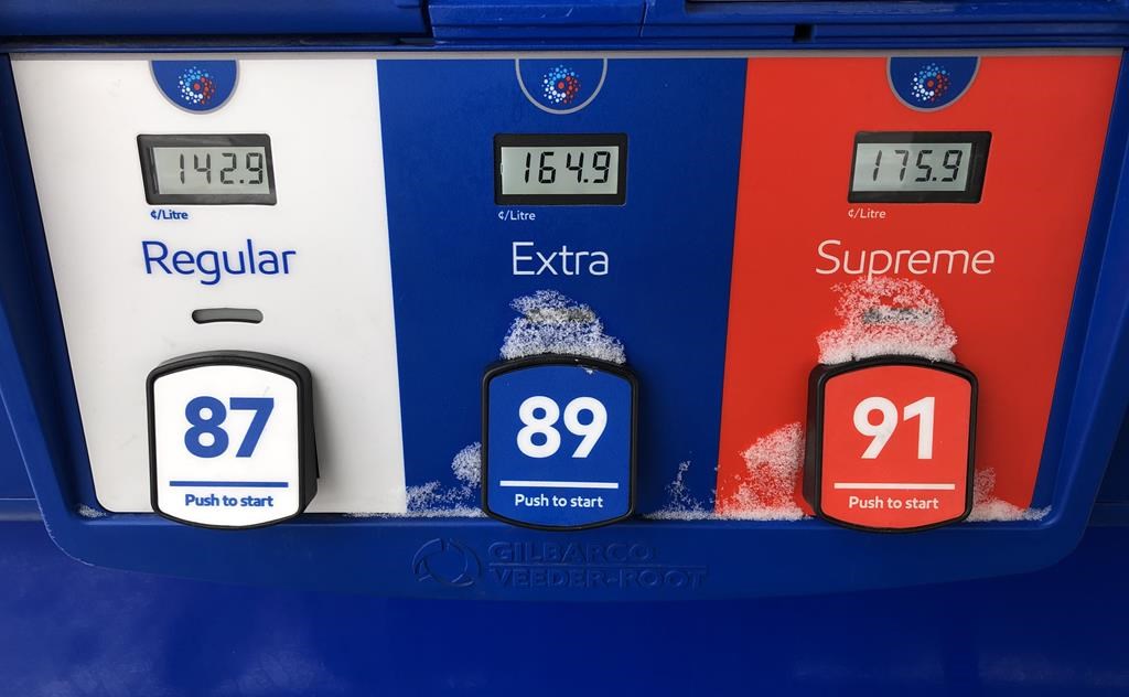 Gas prices are displayed at an Esso station in Oakville, Ont., Saturday, Feb.25, 2023. Canadians heading out on the road for the July 1 long weekend will find filling up at the pumps to be much less shock-inducing than last year at this time. THE CANADIAN PRESS IMAGES/Richard Buchan