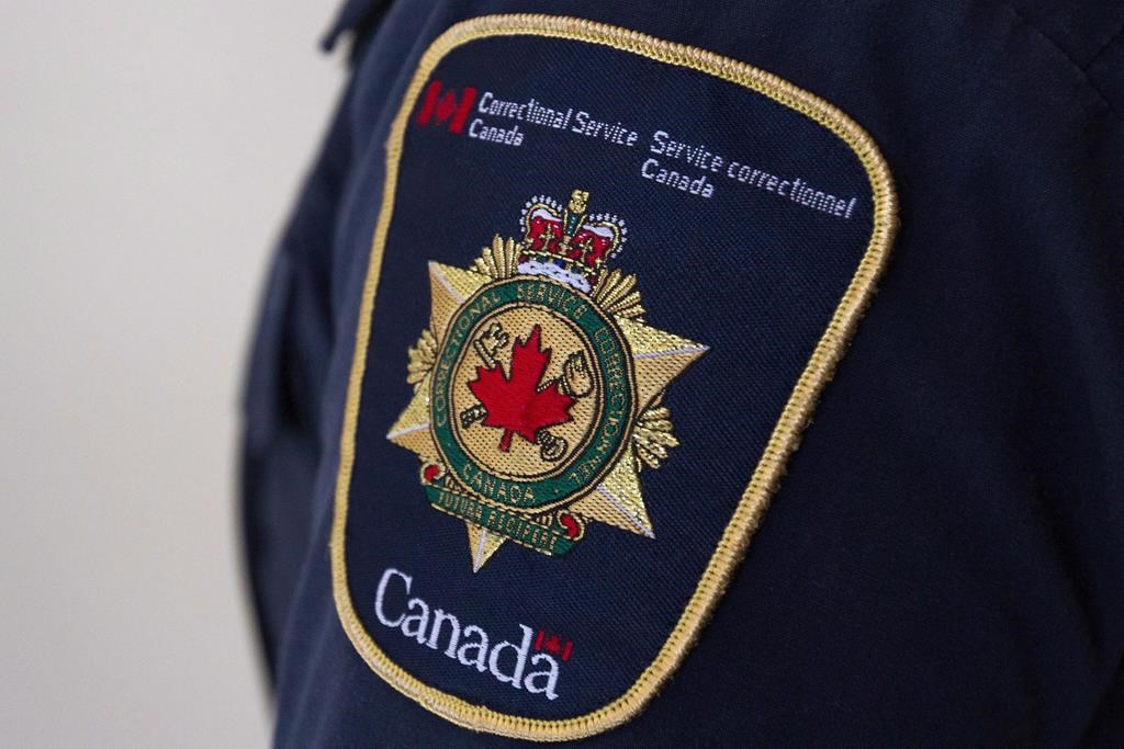 A shoulder patch on a correctional officer is shown at the Collins Bay Institution in Kingston, Ont., on Tuesday, May 10, 2016. The Correctional Service of Canada is defending its decision to uphold Paul Bernardo's privacy rights, as the federal public safety minister says Canadians deserve to know why he was moved to a medium-security prison. THE CANADIAN PRESS/Lars Hagberg