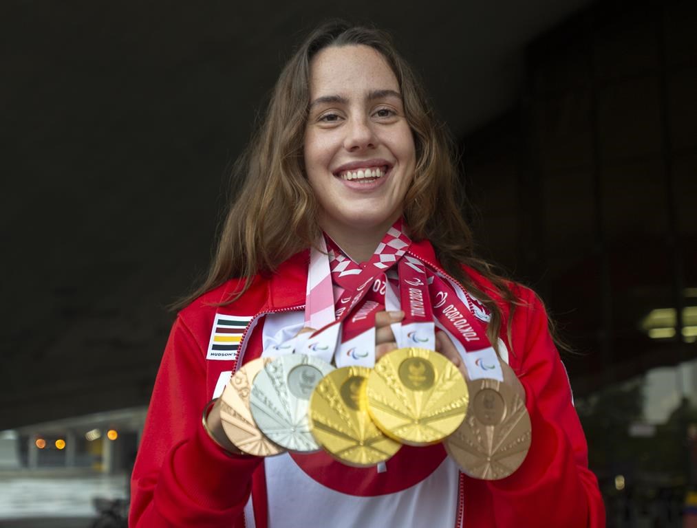 Aurelie Rivard holds her five Paralympic swimming medals from the 2020 Tokyo Games at a news conference, Wednesday, September 8, 2021 in Montreal. Canadian Paralympians will receive financial rewards for winning medals starting at the 2024 Paralympics in Paris this summer. THE CANADIAN PRESS/Ryan Remiorz