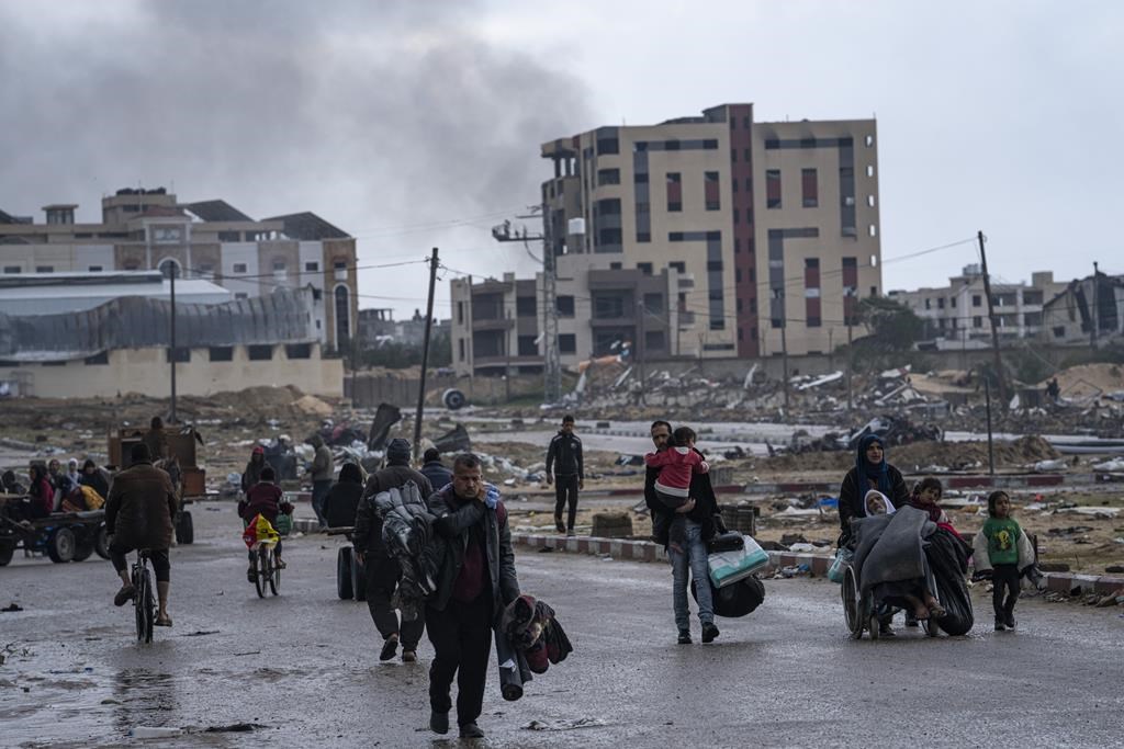 Canada is sending another $40 million in aid to organizations that are helping Palestinians in Gaza after pausing funding to the UN's relief agency in the region. Palestinians arrive in the southern Gaza town of Rafah after fleeing an Israeli ground and air offensive in the nearby city of Khan Younis on Monday, Jan. 29, 2024. THE CANADIAN PRESS/AP/Fatima Shbair