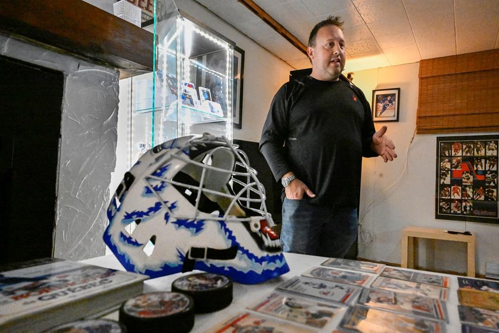 Nordiques fan and NHL souvenir collector Yan Marcil, pictured with memorabilia in his basement in Quebec City, Wednesday, Oct. 2, 2024. THE CANADIAN PRESS/Jacques Boissinot