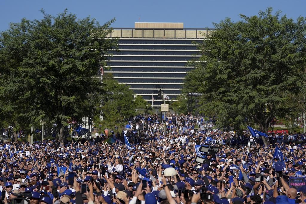 Fans cheer before the Los Angeles Dodgers baseball World Series championship parade Friday, Nov. 1, 2024, in Los Angeles. (AP Photo/Jae C. Hong)