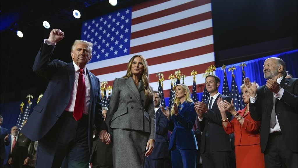 President-elect Donald Trump gestures as he walks with Melania Trump at an election night watch party at the Palm Beach Convention Center, Wednesday, Nov. 6, 2024, in West Palm Beach, Fla. A picture of Trump's second administration is starting to emerge with key positions going to his most loyal supporters. (AP Photo/Evan Vucci)