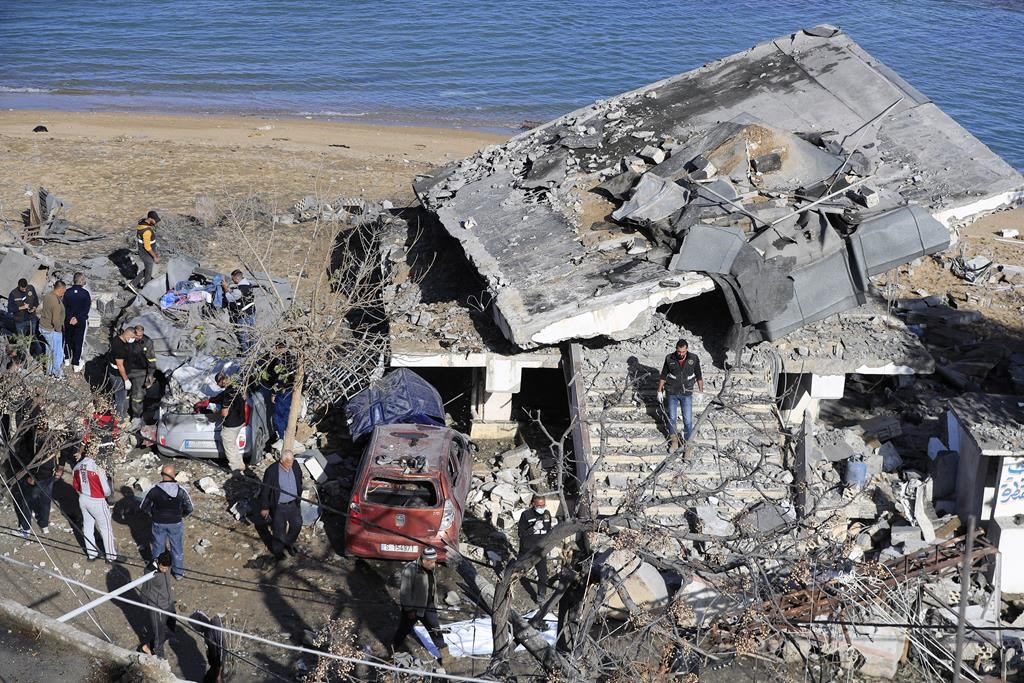 Lebanese Army Intelligence members inspect an army position that was damaged in an Israeli airstrike on Tuesday night, in Sarafand, southern Lebanon, Wednesday, Nov. 20, 2024. (AP Photo/Mohammed Zaatari)