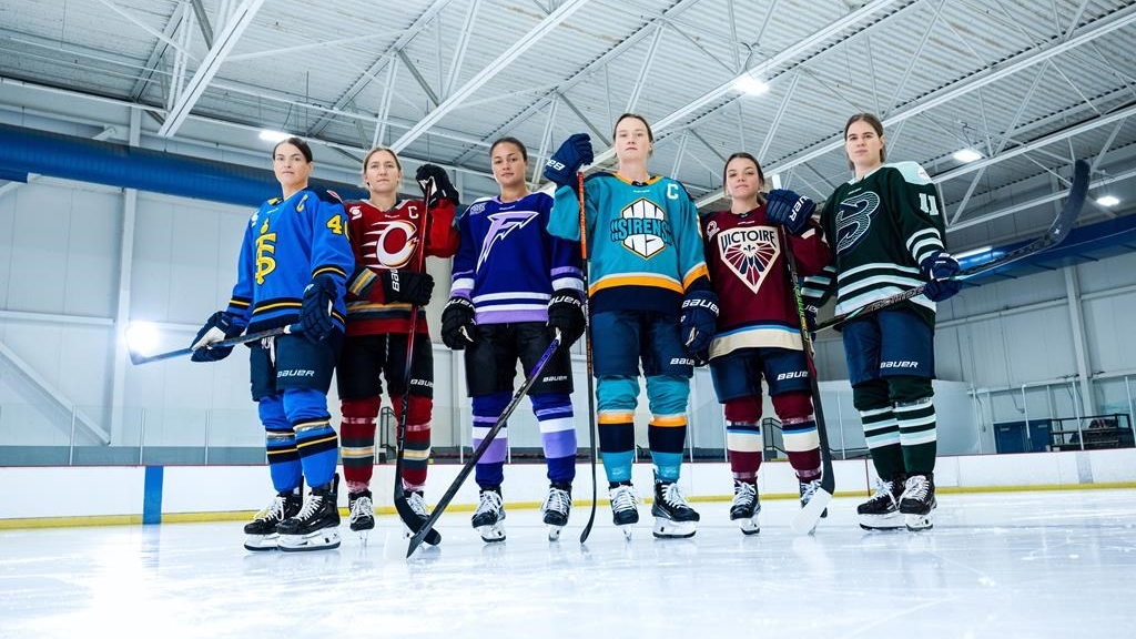 Toronto Sceptres' Blayre Turnbull, left to right, Ottawa Charge's Brianne Jenner, Minnesota Frost's Sophie Jaques, New York Sirens' Micah Zandee-Hart, Montreal Victoire's Cayla Barnes and Boston Fleet's Alina Mueller pose with the each team's new PWHL hockey jersey in an Oct. 29, 2024, handout photo. THE CANADIAN PRESS/HO-PWHL, *MANDATORY CREDIT*