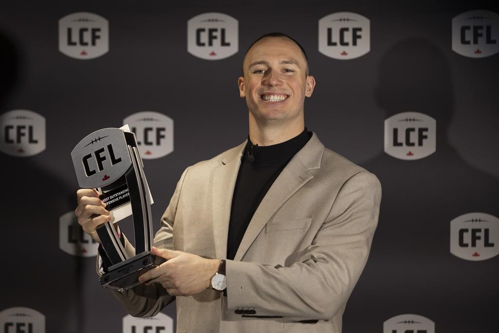 B.C. Lions' Mathieu Betts with his award for the Most Outstanding Defensive Player at the 2023 Canadian Football League (CFL) Awards in Niagara Falls, Ont. Thursday, November 16, 2023. Betts, one of the CFL's most coveted free agents, is returning to the NFL. THE CANADIAN PRESS/Tara Walton