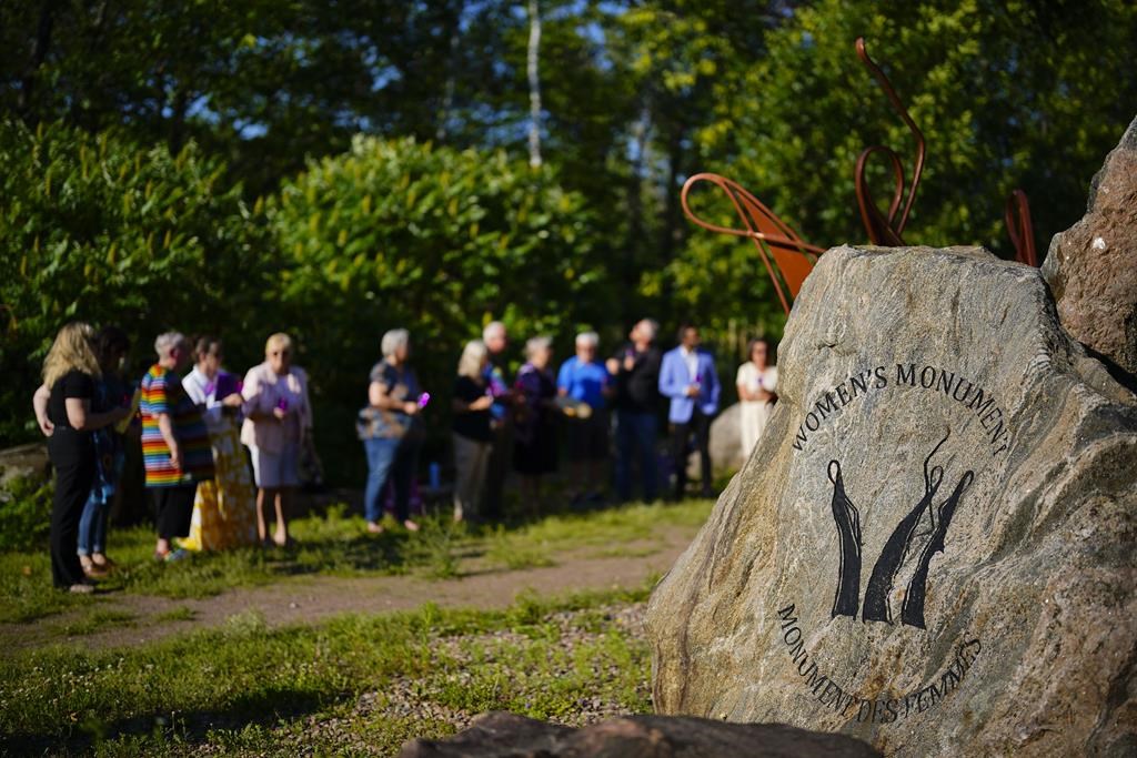 Ontario says it will support an opposition bill to declare intimate partner violence an epidemic in the province. People take part in a vigil at the Women's Monument in Petawawa, Ont., following the jury's release of recommendations in the Borutski Inquest in Pembroke, Ont., on Tuesday, June 28, 2022. THE CANADIAN PRESS/Sean Kilpatrick