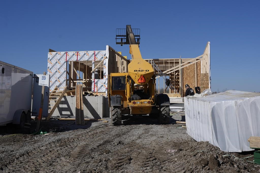 Canada Mortgage and Housing Corp. says the annual pace of housing starts in March declined seven per cent compared with February. Work continues at a new housing development in Belleville, Ont., on Friday, March 1, 2024. THE CANADIAN PRESS/Chris Young