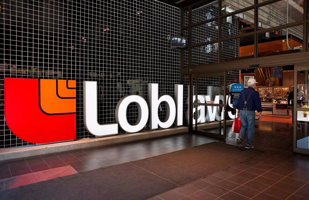 Grocery and drugstore retailer Loblaw Cos. Ltd. raised its quarterly dividend by 15 per cent as it reported its first-quarter profit and revenue rose compared with a year ago. A Loblaws store is shown in Toronto on Thursday May 2, 2013. THE CANADIAN PRESS/Aaron Vincent Elkaim