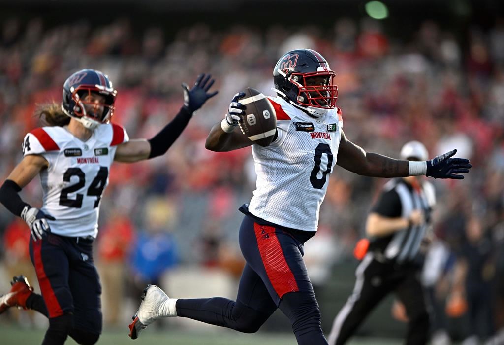Montreal Alouettes defensive end Shawn Lemon scores a touchdown after a fumble by Ottawa Redblacks quarterback Dustin Crum, not shown, during second half CFL football action in Ottawa, Saturday, Sept. 30, 2023. Suspended lineman Lemon is on the field at Montreal Alouettes training camp Tuesday. THE CANADIAN PRESS/Justin Tang