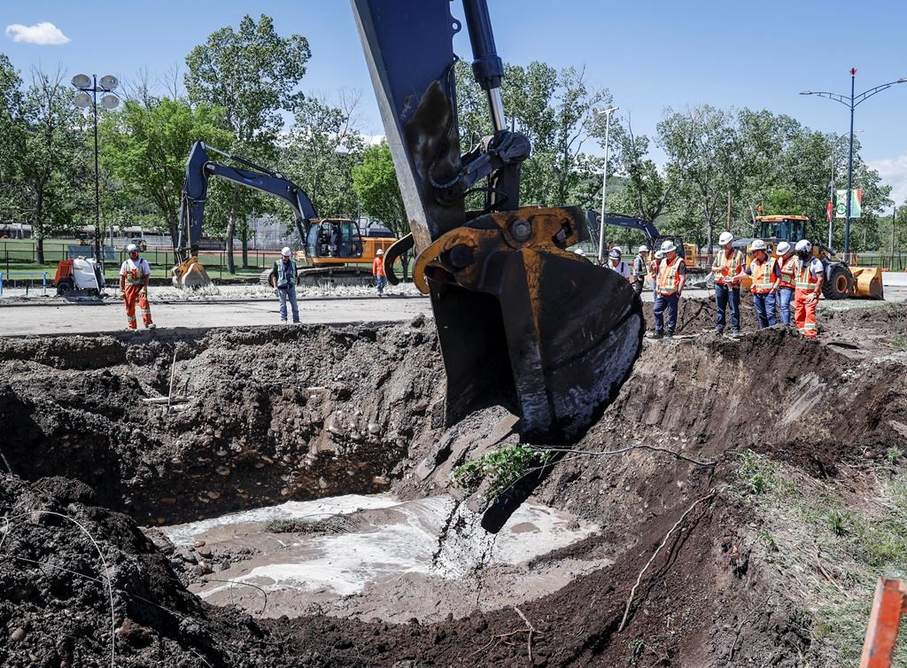 Wednesday marks two weeks since a massive pipe ruptured in Calgary and left its residents under water restrictions. Work to repair a the water main stretches into a second day in Calgary, Friday, June 7, 2024.THE CANADIAN PRESS/Jeff McIntosh