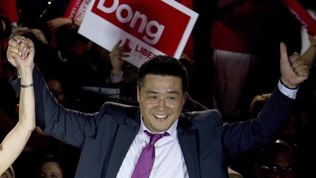 Provincial Liberal candidate Han Dong celebrates with supporters while taking part in a rally in Toronto on Thursday, May 22, 2014. THE CANADIAN PRESS/Nathan Denette