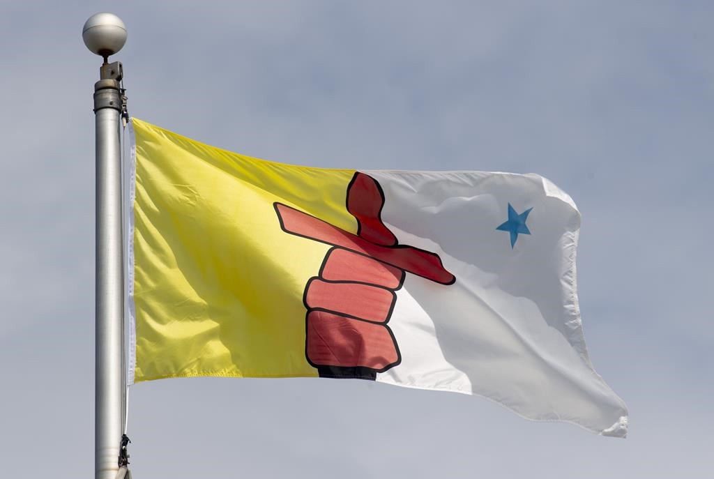 A Nunavut judge has sentenced a Toronto woman to three years in prison in a case of Inuit identity fraud. Nunavut's territorial flag flies in Ottawa, Tuesday June 30, 2020. THE CANADIAN PRESS/Adrian Wyld