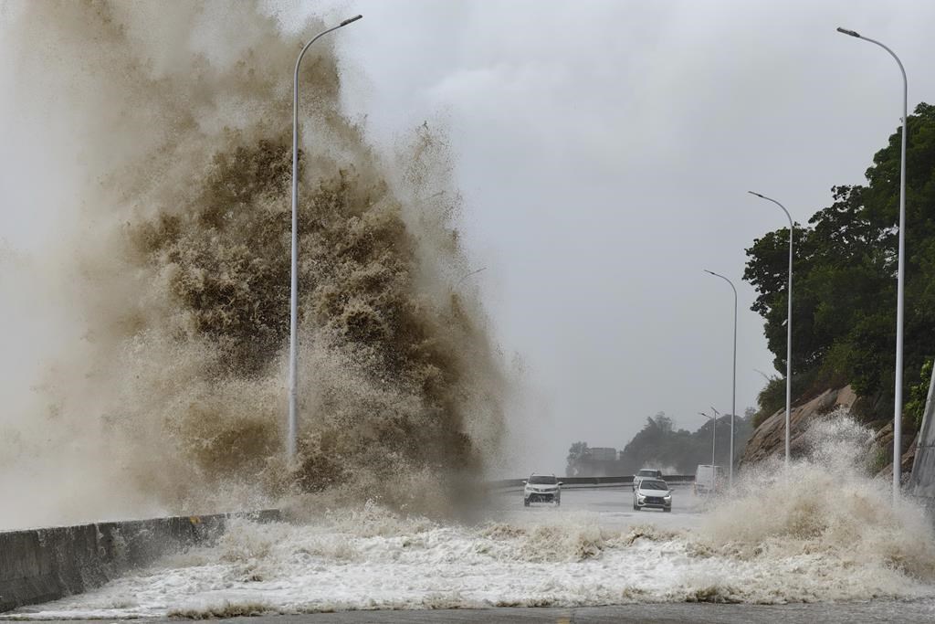 In this photo released by Xinhua News Agency, huge waves lash the shore ahead of landfall by Typhoon Gaemi in Sansha Township of Xiapu County, southeast China's Fujian Province, Thursday July 25, 2024. After hitting Philippines and Taiwan, the storm's effects were expected to continue into Friday as it moved in a northwestern direction toward mainland China. In Fujian province on China's east coast, ferry routes were suspended on Wednesday and all train service will be halted on Thursday, China's official Xinhua News Agency said. (Jiang Kehong/Xinhua via AP)