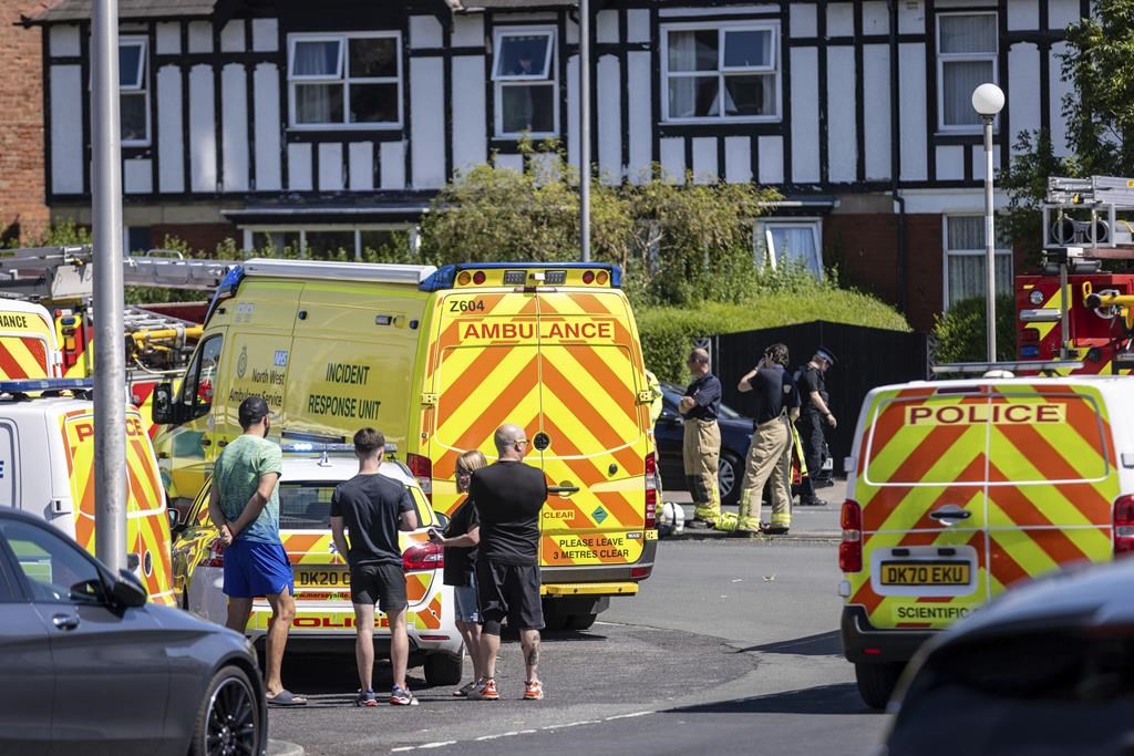 Police and emergency services arrive at the site where a man has been detained and a knife has been seized after a number of people were injured in a reported stabbing, in Southport, Merseyside, England, Monday July 29, 2024. (James Speakman/PA via AP)