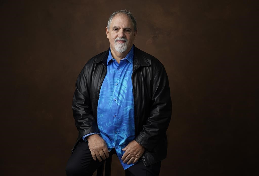 FILE - Jon Landau stands for a portrait at the 95th Academy Awards Nominees Luncheon, Feb. 13, 2023, at the Beverly Hilton Hotel in Beverly Hills, Calif. Landau, an Oscar-winning producer who worked closely with director James Cameron on “Titanic" and the “Avatar” series, has died, announced in a statement Saturday, July 6, 2024. (AP Photo/Chris Pizzello, File)