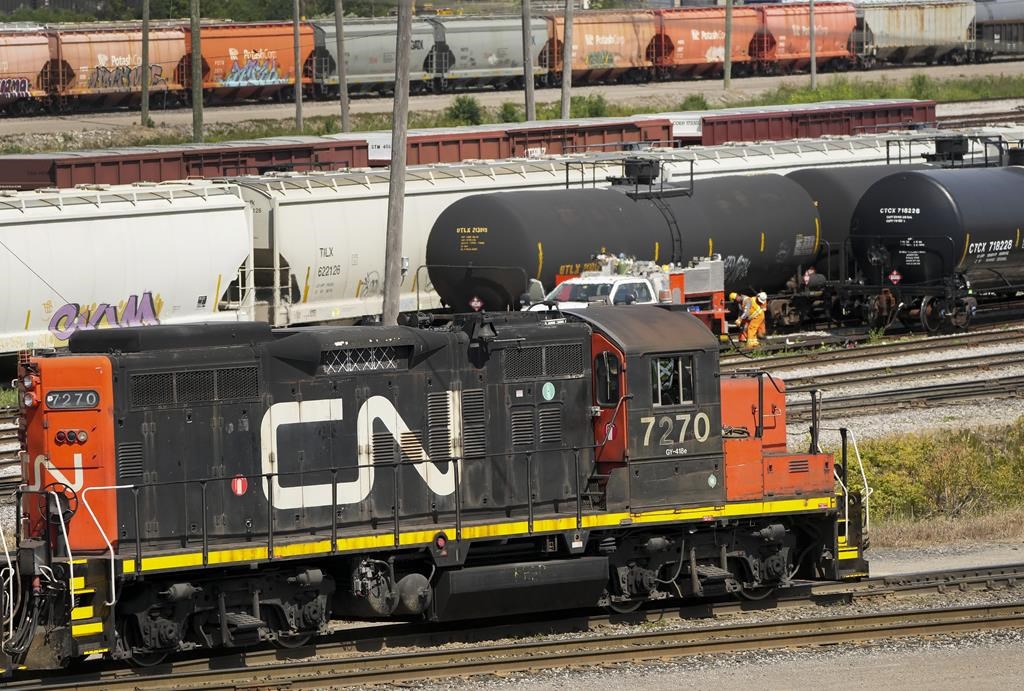 The country's two main railways are starting to block shipments of hazardous goods ahead of a potential strike or lockout next week. CN rail trains are shown at the CN MacMillan Yard in Vaughan, Ont., on Monday, June 20, 2022. THE CANADIAN PRESS/Nathan Denette