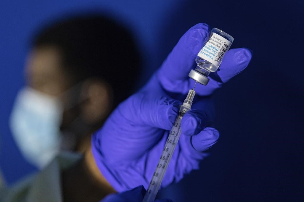 <p>A family nurse practitioner prepares a syringe with the mpox vaccine for inoculating a patient at a vaccination site in the Brooklyn borough of New York, on Tuesday, Aug. 30, 2022. THE CANADIAN PRESS/AP-Jeenah Moon</p>