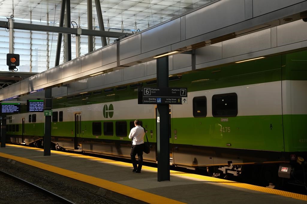 More than 32,000 rail commuters across the country will have to find new routes to work if a strike or lockout kicks off at Canadian Pacific Kansas City Ltd. this week. A man walks along an empty platform as a train stands idle at Toronto's Union Station, Tuesday, Oct. 3, 2023. THE CANADIAN PRESS/Chris Young