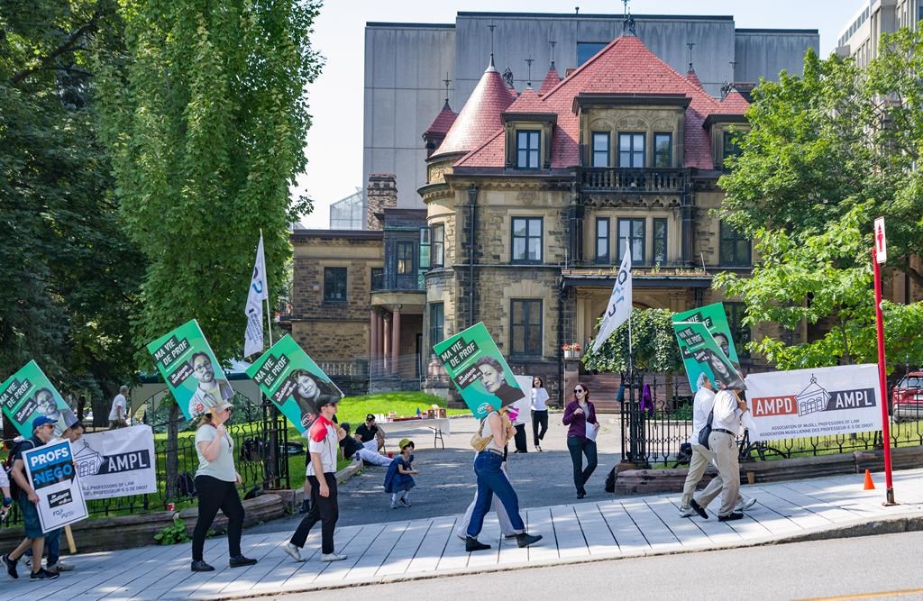 McGill University law professors strike outside the law faculty in Montreal, Monday, Aug. 26, 2024. THE CANADIAN PRESS/Christinne Muschi
