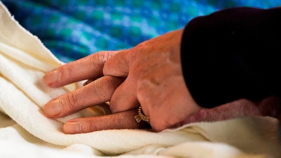 A coalition of disability rights groups says it is launching a Charter challenge against a part of Canada's law on medical assistance in dying.A patient's hand is held at a hospital, in Minneapolis, Monday, May 3, 2021. THE CANADIAN PRESS-David Joles-Star Tribune via AP